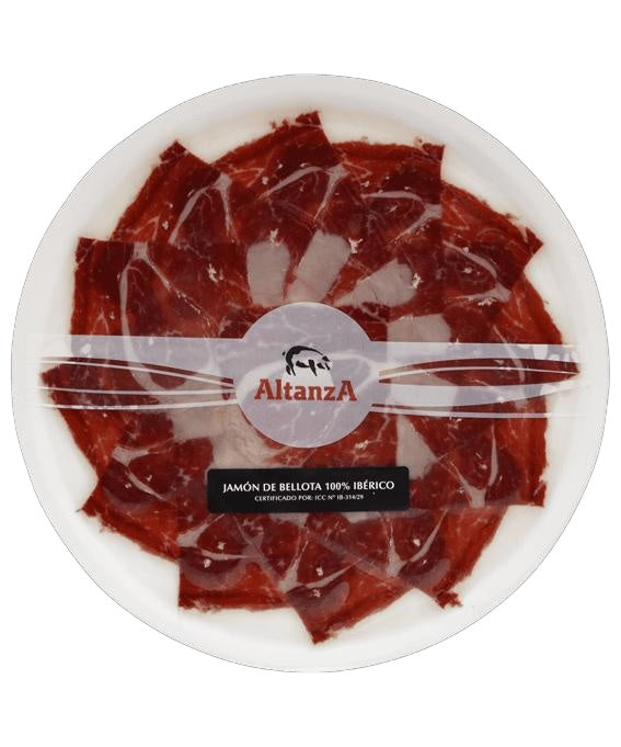 Photographie réelle de l’assiette de jambon Altanza Bellota 100% Ibérico emballée, 80 g, tranchée à la machine avec effet couteau.